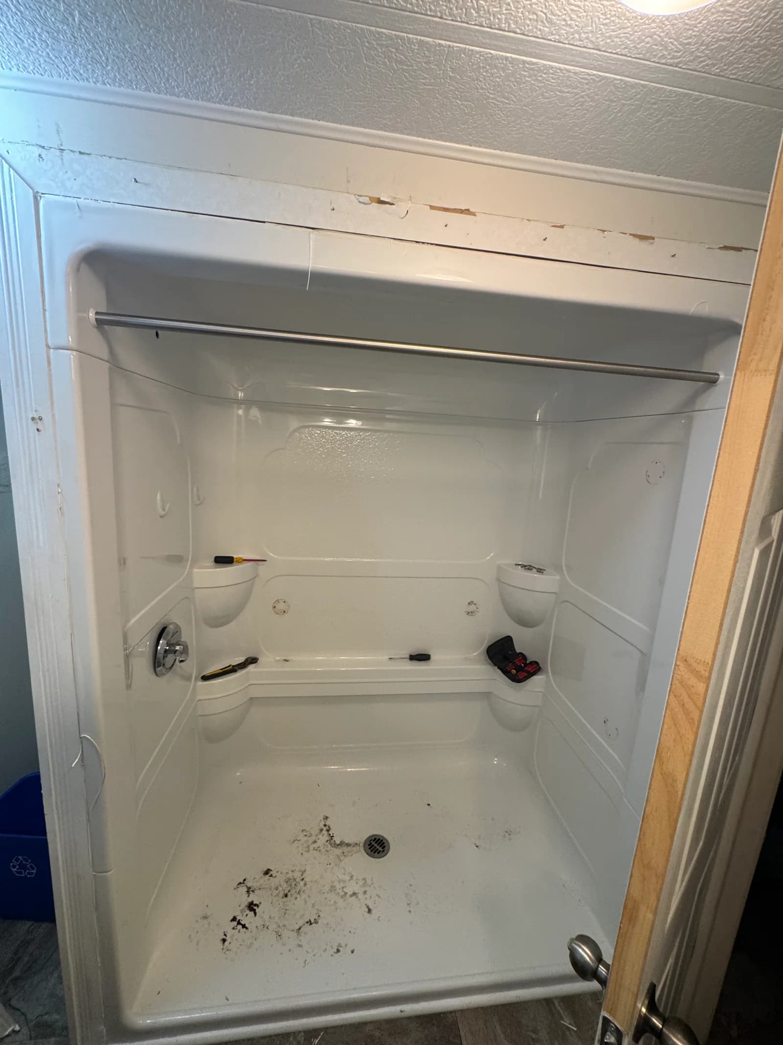 Fiberglass tub and shower enclosure before renovation